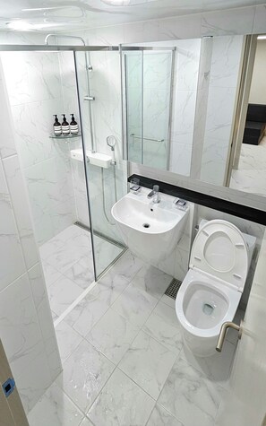 Shower, hair dryer, towels, soap