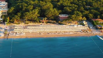 Sun loungers, beach umbrellas, beach towels
