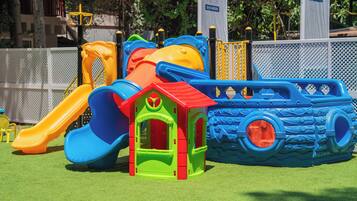 A playground with slides and climbing structures.