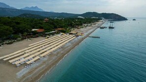 Sun loungers, beach umbrellas, beach towels