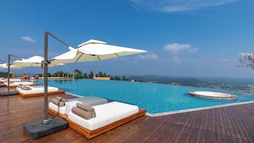 Outdoor pool, open 9:00 AM to 9:30 PM, pool umbrellas, sun loungers