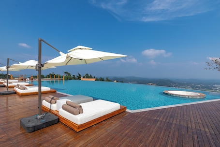 Outdoor pool, open 9:00 AM to 9:30 PM, pool umbrellas, sun loungers
