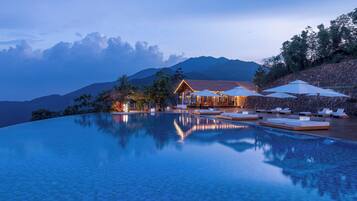 Outdoor pool, open 9:00 AM to 9:30 PM, pool umbrellas, pool loungers