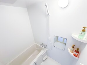 Hair dryer, towels, shampoo, toilet paper