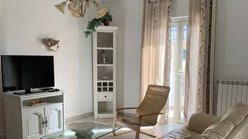 Appartamento del Sole | Living area | Flat-screen TV