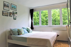 1 bedroom, desk, iron/ironing board, travel crib