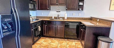 Microwave, dishwasher, coffee/tea maker, cookware/dishes/utensils