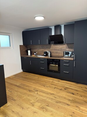 Duplex, Multiple Beds | Private kitchen