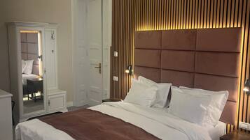 Deluxe Triple Room, City View | In-room safe, blackout drapes, soundproofing, iron/ironing board