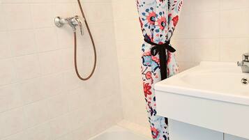 Shower, towels, soap, toilet paper