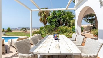 Villa, Sea View | Living area | 55-inch Smart TV with cable channels, fireplace