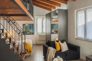 Studio, Multiple Beds (1 Bedroom) | Living area | 32-inch flat-screen TV with cable channels