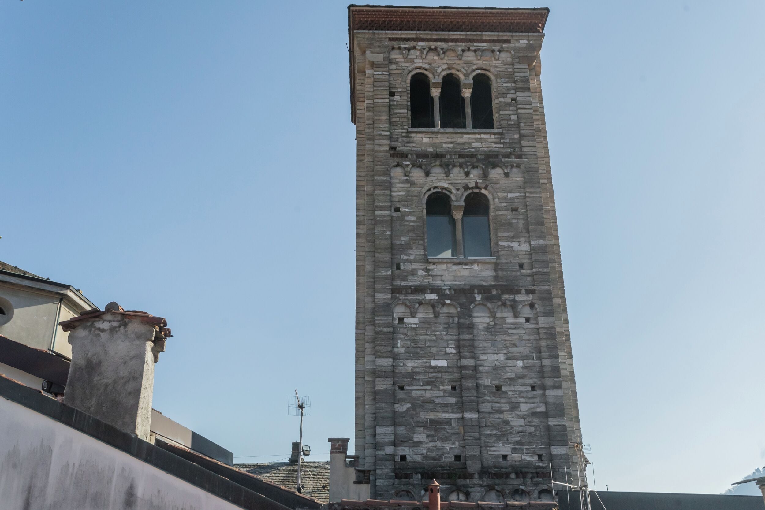 A tall stone tower with arched windows and a flat roof.