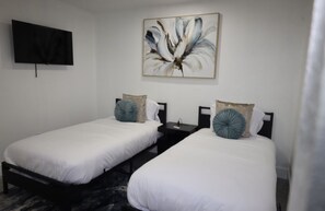 3 chambres, coffres-forts dans les chambres, fer et planche à repasser