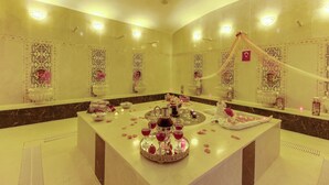A luxurious bathroom with a central island, decorative tiles, and a canopy. - Elite World Nest Sivas (Sivas)