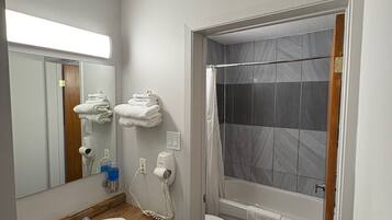 Combined shower/tub, hair dryer, towels, soap