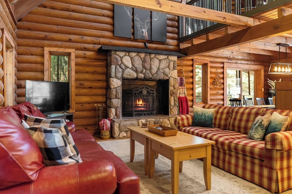 Relax by the warmth of the wood-burning fireplace, surrounded by nature.