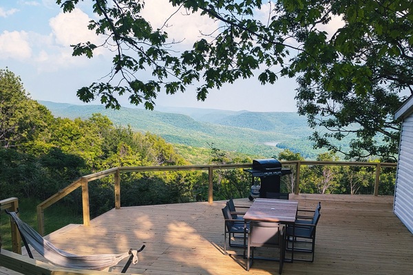 Outdoor dining with gas grill and seating for 6.