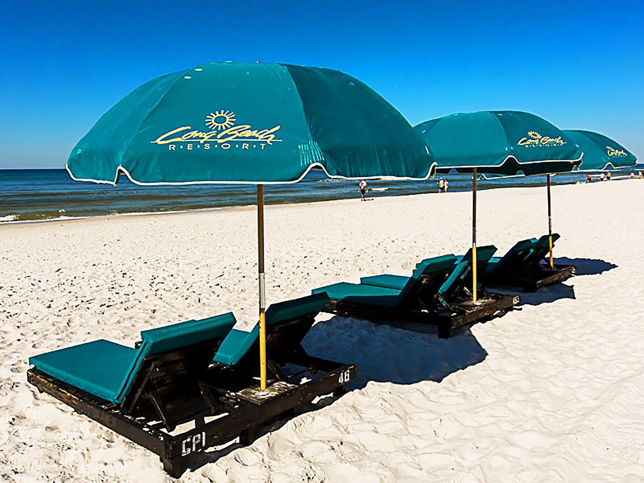 Beach umbrellas and lounge chairs at a resort.