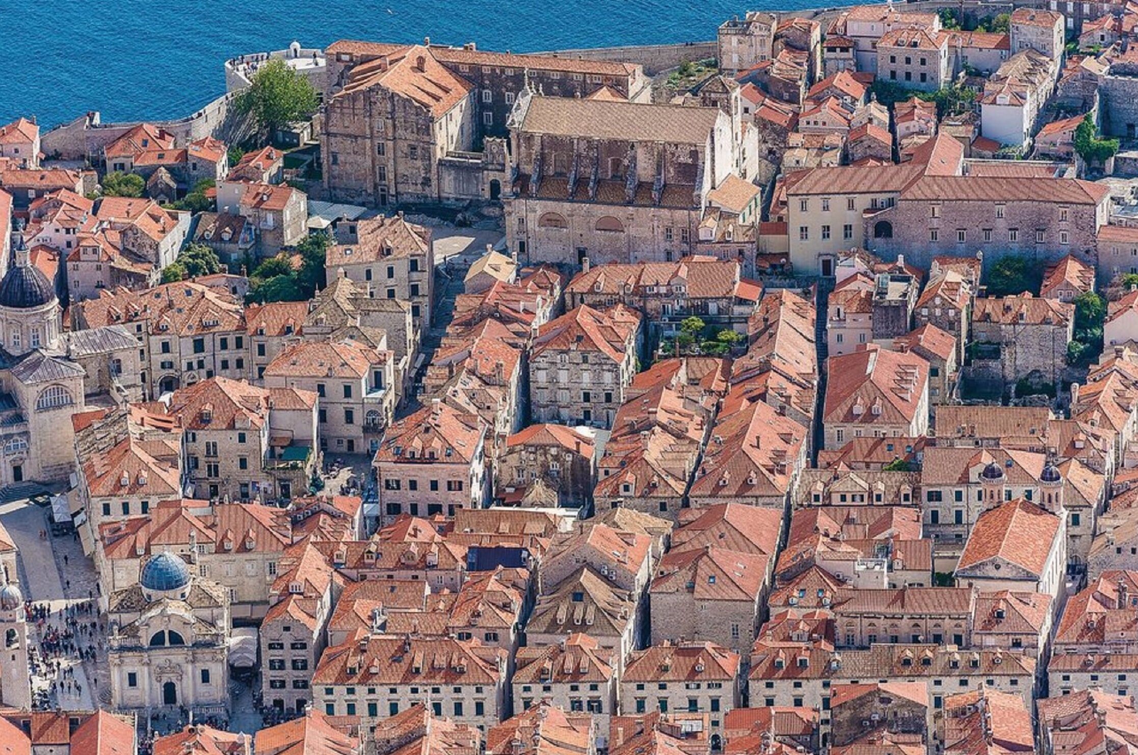 A densely packed urban area with historic buildings and a prominent church.