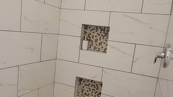 Shower, towels, soap, toilet paper
