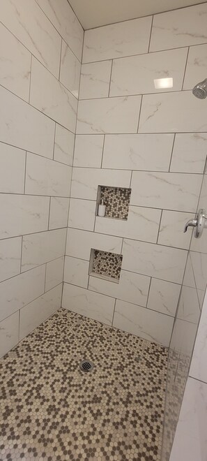 Shower, towels, soap, toilet paper