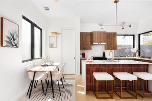 Fridge, dishwasher, dining tables