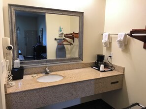 Desk, laptop workspace, blackout drapes, iron/ironing board