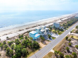 A coastal property with multiple buildings, a beach, and a road. - Sea Forever (Port St. Joe)