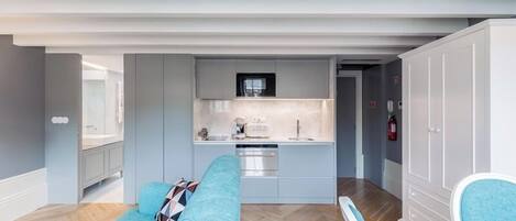 Deluxe Studio, City View | Living area | Flat-screen TV, printers