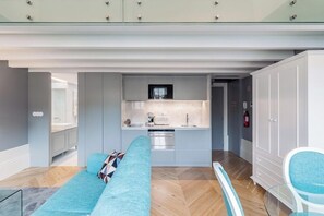 Deluxe Studio, City View | Living area | Flat-screen TV, printers