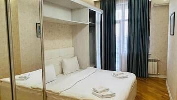 Apartment, 2 Bedrooms, Balcony, City View | Premium bedding, minibar, in-room safe, individually decorated