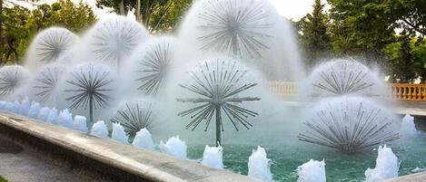 A fountain with multiple water jets arranged in a circular pattern.