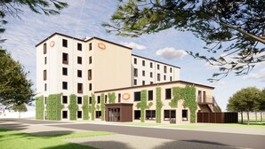 A modern hotel with multiple floors, a central entrance, and a covered outdoor area. - Aiden By Best Western Odense (Odense)