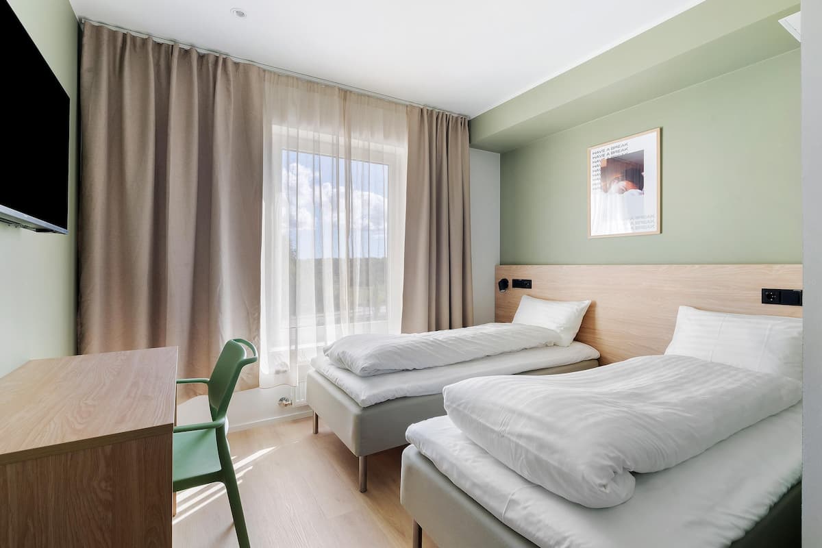 Economy Room, 2 Twin Beds, Non Smoking | Desk, cribs/infant beds, rollaway beds, bed sheets
