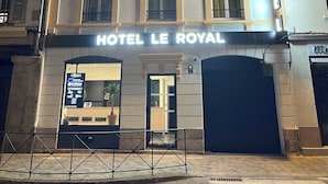 A multi-story hotel with a classic facade, a prominent entrance, and a sign reading "HOTEL LE ROYAL". - Hôtel Le Royal  (Tulle)