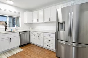 Fridge, cookware/dishes/utensils, dining tables
