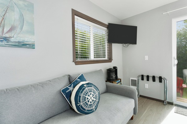 Cozy sitting area with TV and quick access to the patio