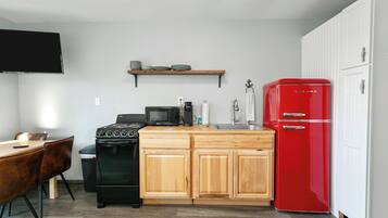 Fridge, cookware/dishes/utensils, dining tables