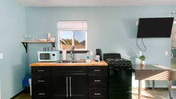Fridge, cookware/dishes/utensils, dining tables