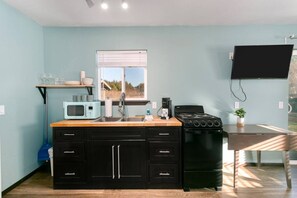 Fridge, cookware/dishes/utensils, dining tables