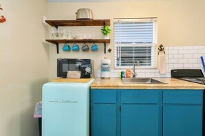 Fridge, cookware/dishes/utensils, dining tables