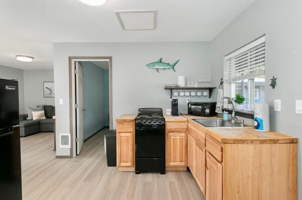 Fridge, cookware/dishes/utensils, dining tables