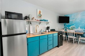 Fridge, cookware/dishes/utensils, dining tables