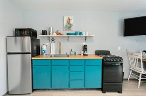 Fridge, cookware/dishes/utensils, dining tables