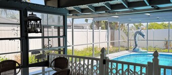 Dog-Friendly Tropical Getaway with a Covered Pool -Nearby Beaches!