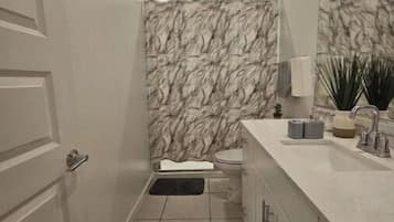Shower, bidet, towels, soap