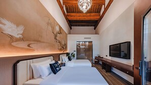 A modern hotel room with a large bed, a flat-screen TV, a wooden ceiling, and a mural on the wall. - lishe (Jinzhong)