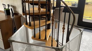 A modern kitchen with a staircase, wooden railings, and a glass partition. - Ahr valley heart (Bad Neuenahr-Ahrweiler)