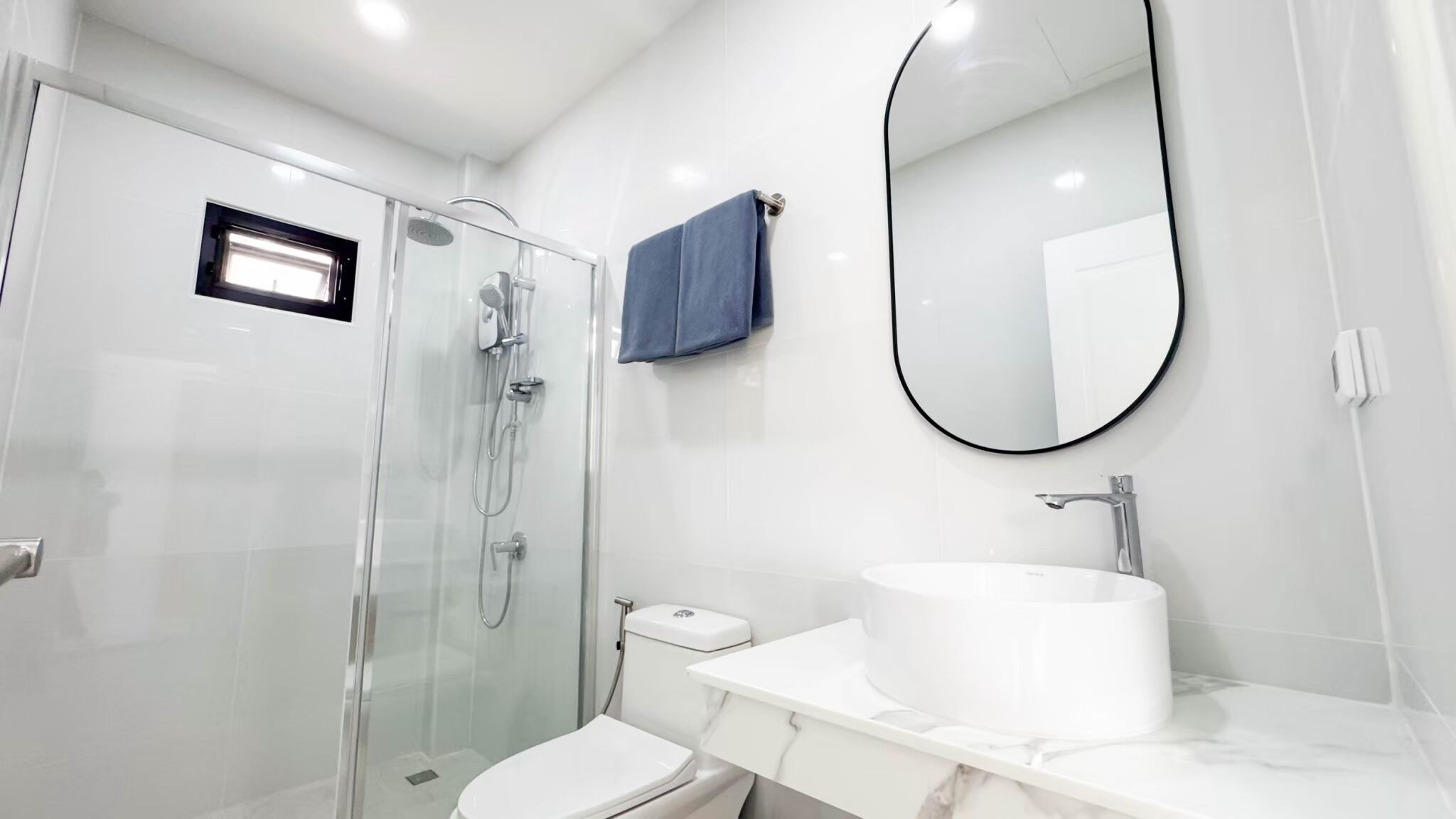 Shower, hair dryer, towels, soap